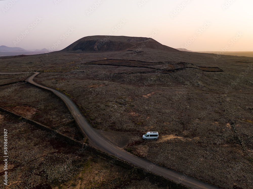 View from above, stunning aerial view of a van parked under the Calderon Hondo in Fuerteventura, Canary Islands