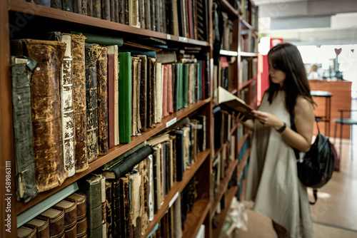 Woman in old book store