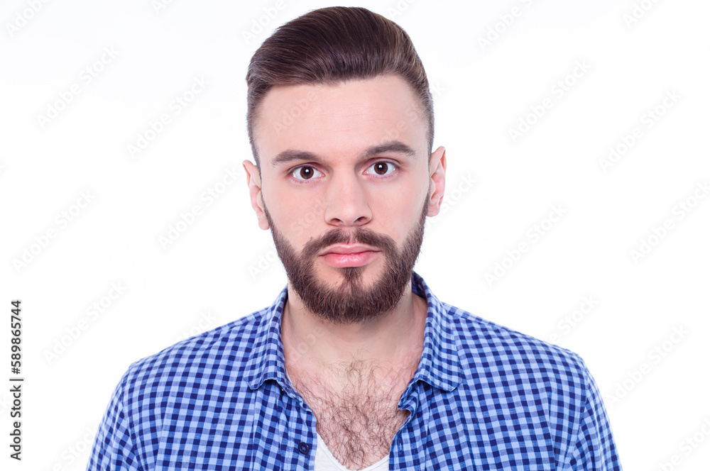 Strong, confident, handsome and bearded man in casual checkered shirt is posing isolated on white background with copy space for text and advertising