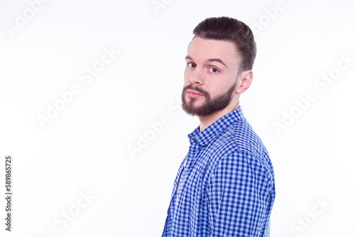 Profile or side view portrait of handsome young bearded stylish man in checkered shirt isolated over white background