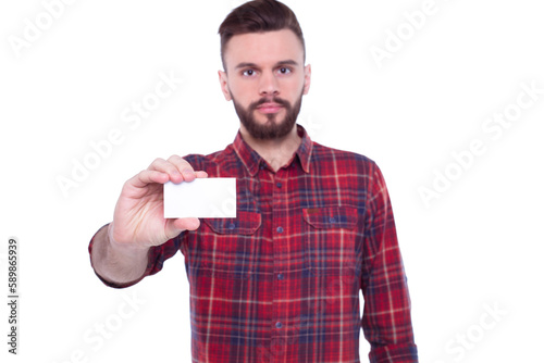Young handsome bearded man in checkered shirt with white visit or bank card in hand