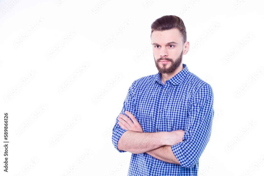 Strong, confident, handsome and bearded man in casual checkered shirt is posing isolated on white background with copy space for text and advertising Strong, confident, handsome and bearded man in casual checkered shirt is posing isolated on white background with copy space for text and advertising