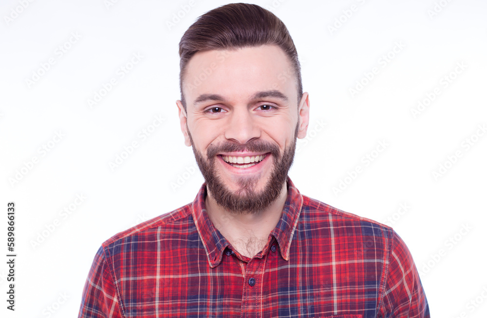 Strong, confident, handsome and bearded man in casual checkered shirt is posing isolated on white background with copy space for text and advertising Strong, confident, handsome and bearded man in casual checkered shirt is posing isolated on white background with copy space for text and advertising