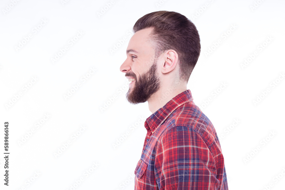 Profile or side view portrait of handsome young bearded stylish man in checkered shirt isolated over white background Profile or side view portrait of handsome young bearded stylish man in checkered shirt isolated over white background