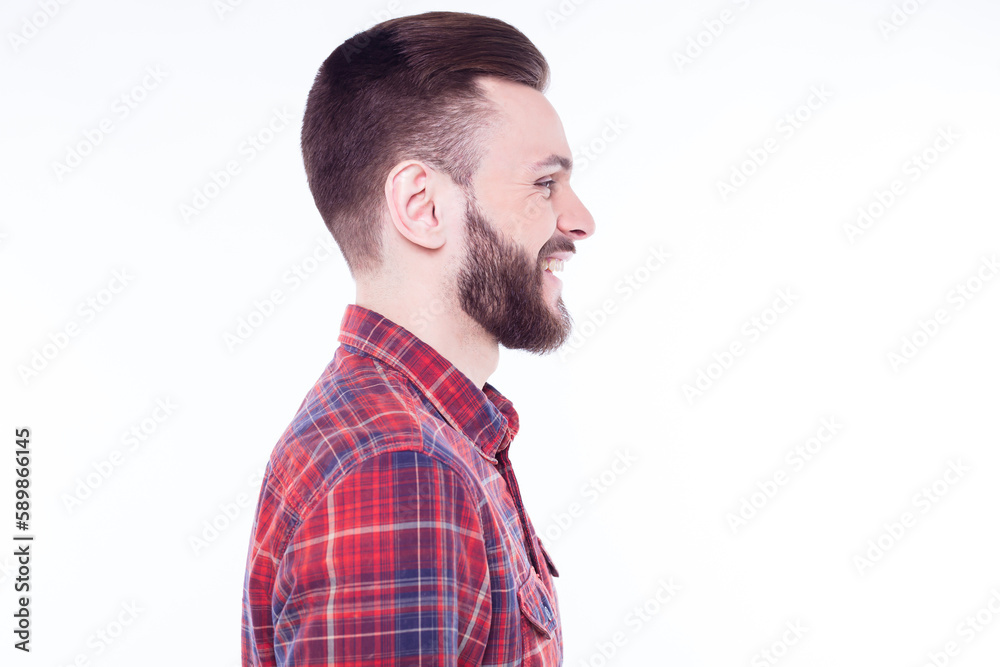 Profile or side view portrait of handsome young bearded stylish man in checkered shirt isolated over white background Profile or side view portrait of handsome young bearded stylish man in checkered shirt isolated over white background