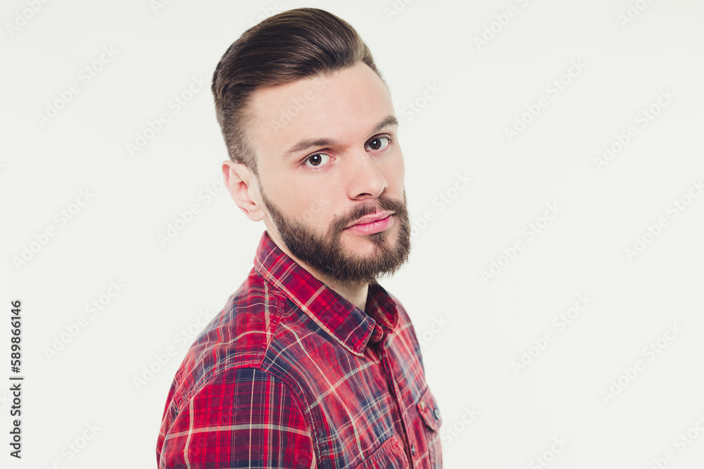 Profile or side view portrait of handsome young bearded stylish man in checkered shirt isolated over white background Profile or side view portrait of handsome young bearded stylish man in checkered shirt isolated over white background