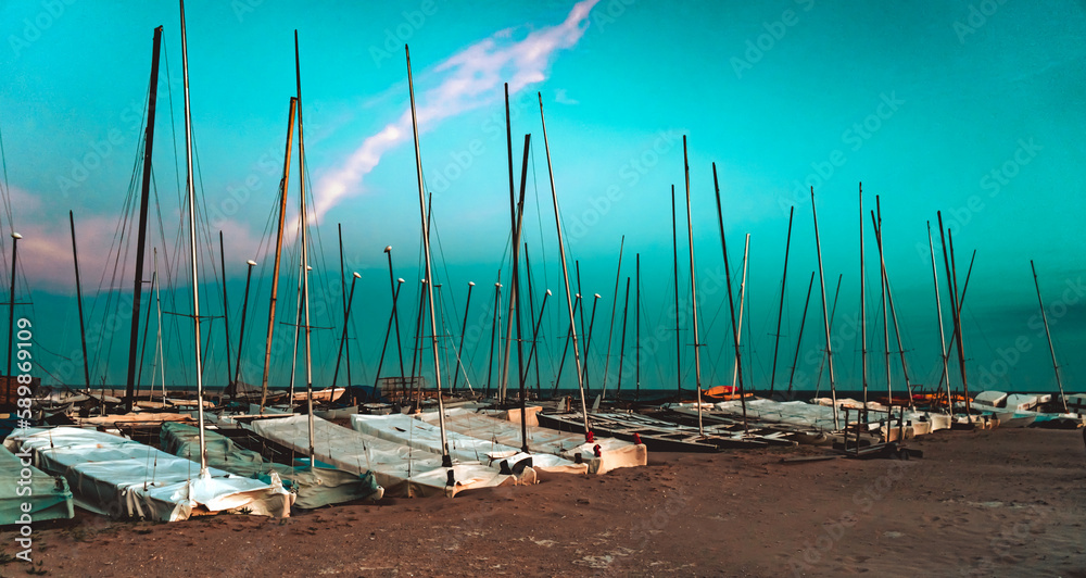 SAILBOATS ON BEACH AT COSTA BRAVA SPAIN