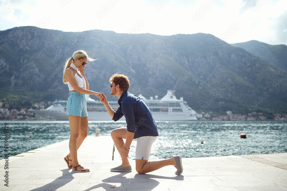 Romantic proposal on the lake. man proposal his girl on vacation