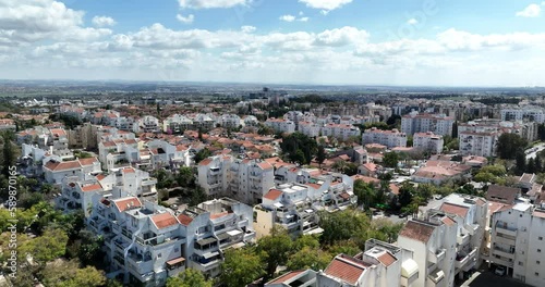 Aerial footage of the skyline of the northern city of Kfar Saba. Filmed in C4K Apple ProRes 422 HQ photo