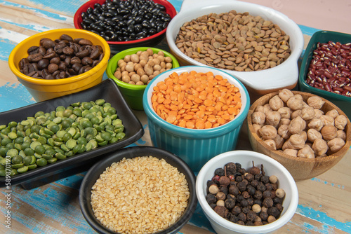 assorted bowls with raw grain and seeds top view