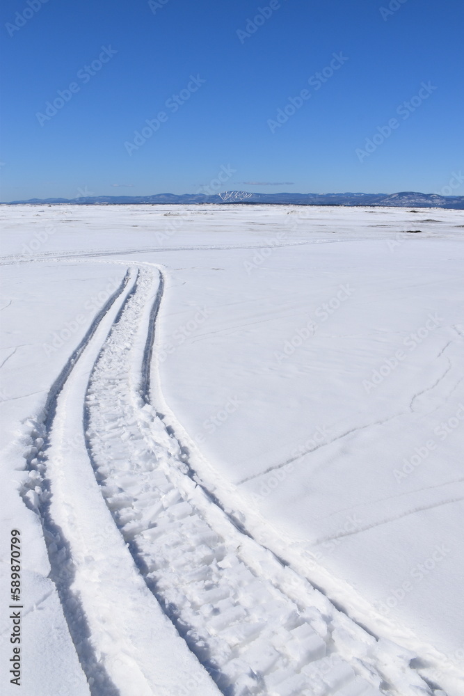 A snowmobile trail on the river, Montmagny, Québec, Canada