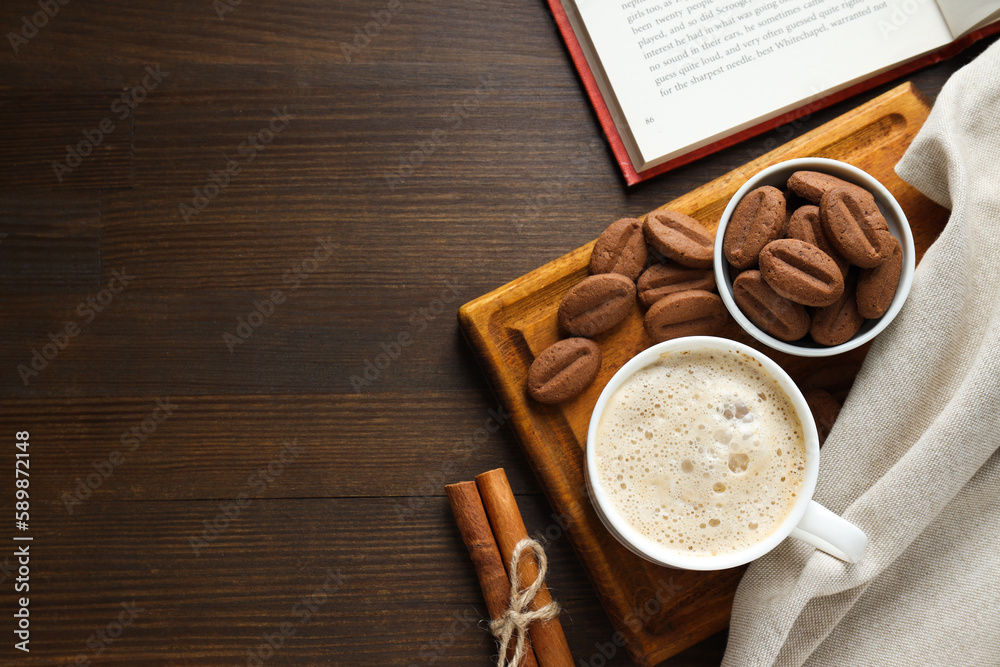 Concept of tasty snack for hot drink - cookies in the shape of coffee seeds Concept of tasty snack for hot drink - cookies in the shape of coffee seeds