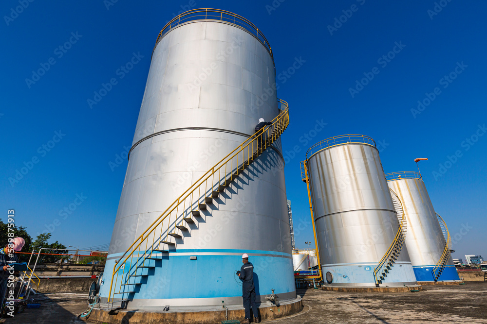 Male worker inspection visual storage tank oil