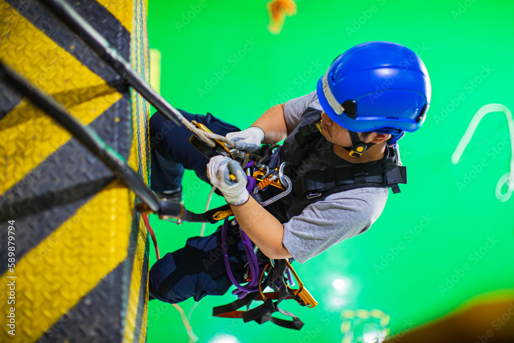 Top view male worker training rope access Top view male worker training rope access
