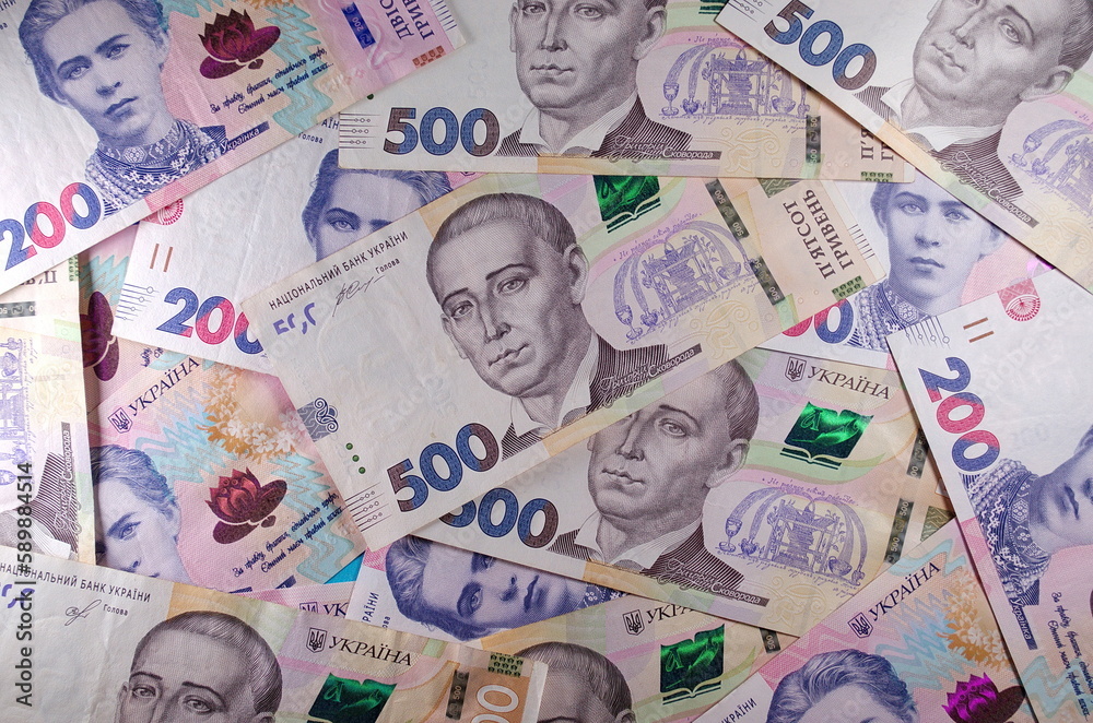 Obraz premium Money of Ukraine. Background of ukrainian hryvnia banknotes. Hryvnia 500, 200. Uah. Money and save concept. 