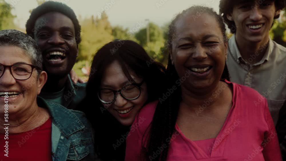 Happy multigenerational people with different ethnicity having fun smiling into the camera - Diversity concept Happy multigenerational people with different ethnicity having fun smiling into the camera - Diversity concept