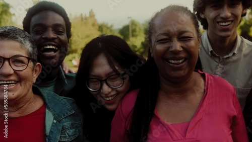 Happy multigenerational people with different ethnicity having fun smiling into the camera - Diversity concept