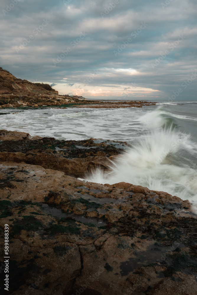 A rocky coastline on a cloudy day