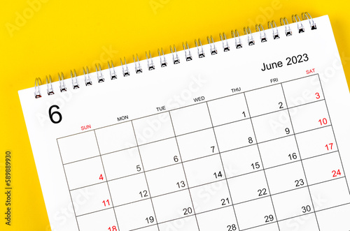 The June 2023 Monthly desk calendar for 2023 year on yellow background. © gamjai