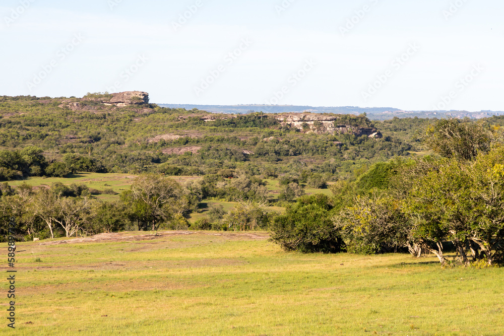 Farm field, forest and geological formations