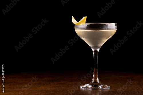 Glass of Agent 007's Special Vesper Cocktail with orange peel garnish close-up photo