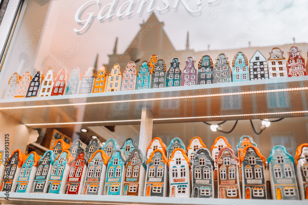 Color ceramic houses, Famous souvenir miniature in a shop window from Gdansk, Poland display on the market, Vintage housing background. High quality photo