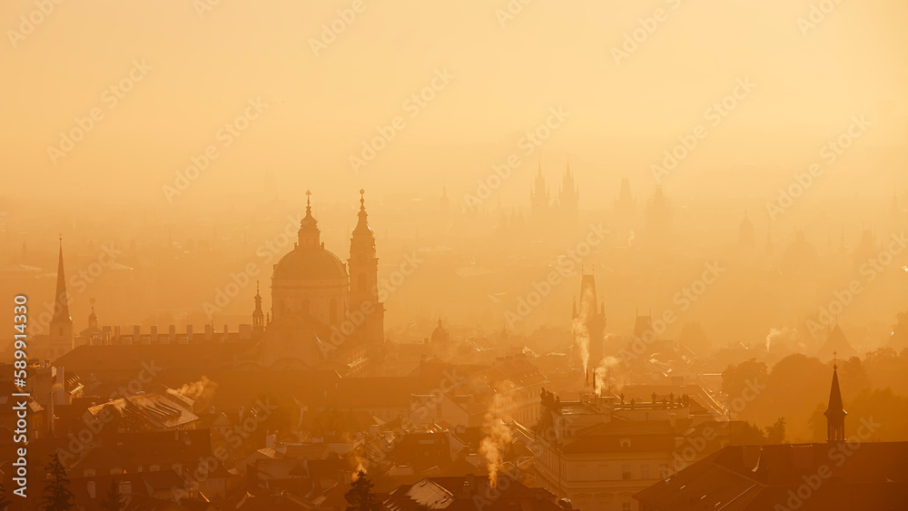 Obraz premium Prague cityscape in morning light. Towers of Lesser Town in autumn fog, Czech Republic..
