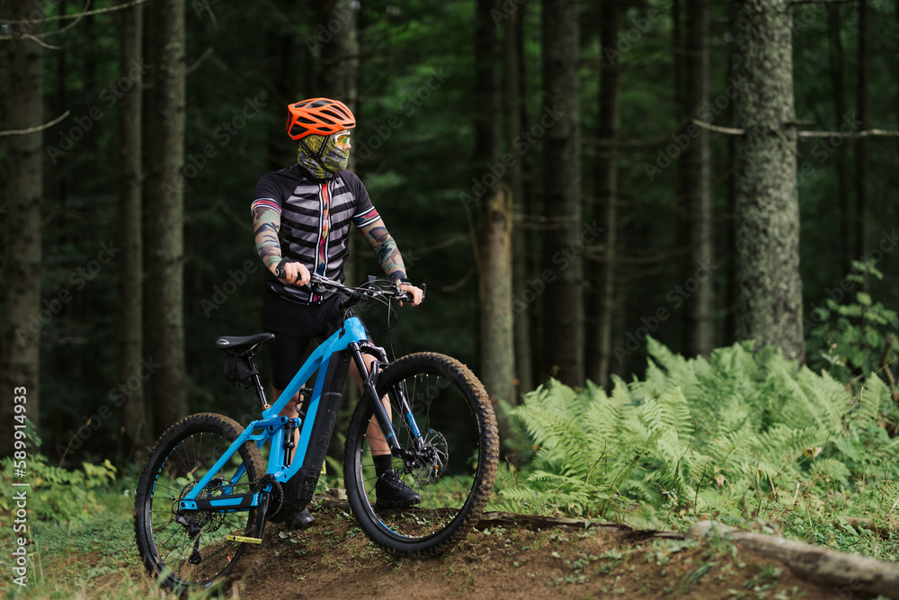 A cyclist rides a bicycle. Down the hill.