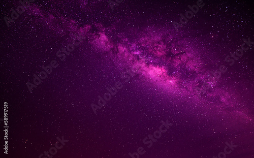 Violet Pink  Purple night sky milky way and star on dark background.Universe filled with stars  nebula and galaxy with noise and grain.Photo by long exposure and select white balance.