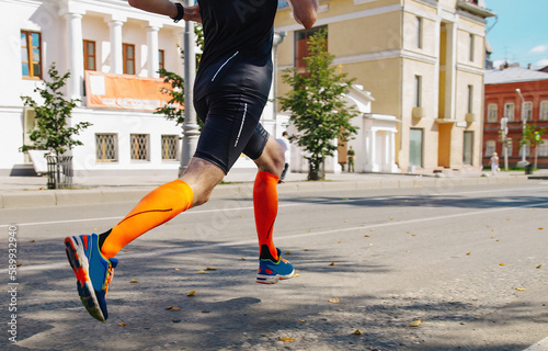 Εκτύπωση καμβά male runner in compression socks running street summer marathon race, endurance