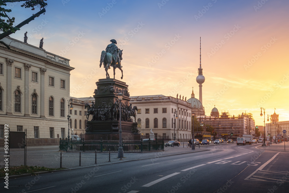 Unter den Linden Boulevard with Frederick the Great Statue and Fernsehturm TV Tower at sunrise - Berlin, Germany