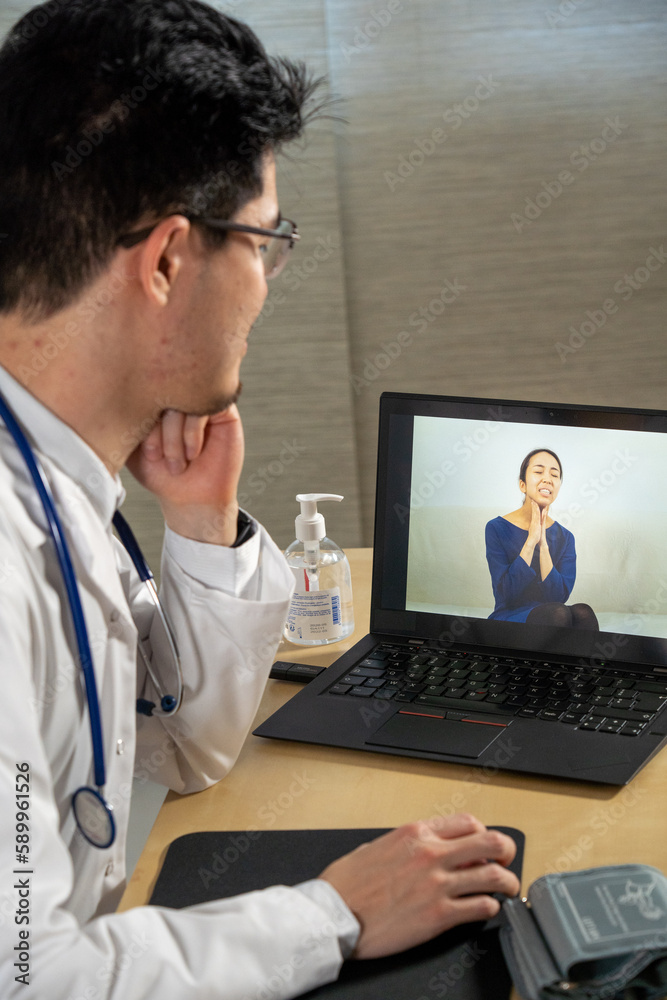 Doctor in remote consultation with 30 year old female patient with pain in her throat. Doctor in remote consultation with 30 year old female patient with pain in her throat.