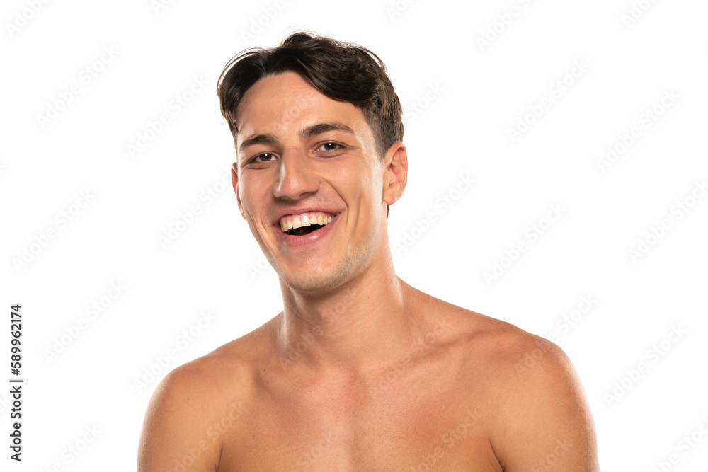 Closeup portrait of happy shirtless man 20s looking at camera isolated over white background Closeup portrait of happy shirtless man 20s looking at camera isolated over white background