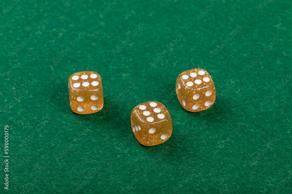 Three Yellow Dice on Green Velvet Casino Table for Gaming and Gambling, 6,6,6 Three Yellow Dice on Green Velvet Casino Table for Gaming and Gambling, 6,6,6