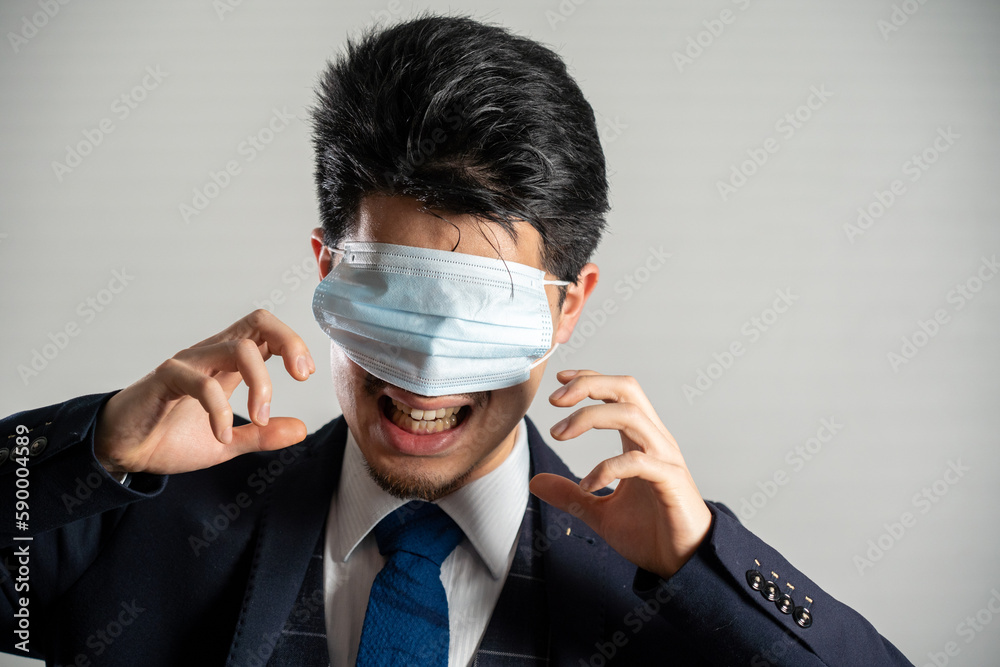 Screaming man wearing a mask over his eyes. Screaming man wearing a mask over his eyes.