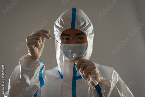 Medical personnel performing an antigen test for covid-19.