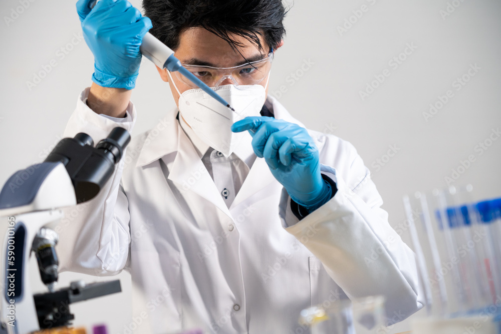 Laboratory assistant conducting experiments for laboratory research. Laboratory assistant conducting experiments for laboratory research.