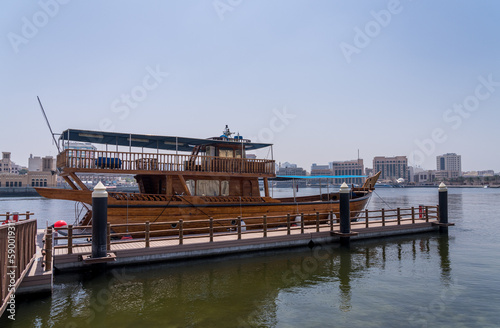 Canvas Print Cruise boat in the Creek in the Al Shindagha district and museum in Bur Dubai
