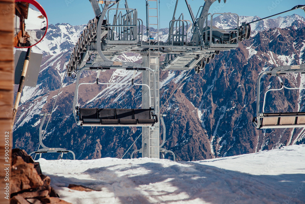 Fototapeta premium Cable car in the beautiful winter snow mountains.