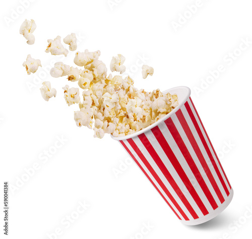 A striped bucket with flying popcorn isolated on a white background.