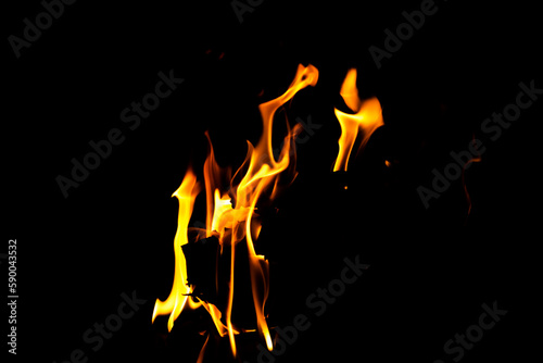 Fire flame texture. Burning material backdrop. Burn effect pattern. Blaze and torch wallpaper. Heat and haze backdrop.