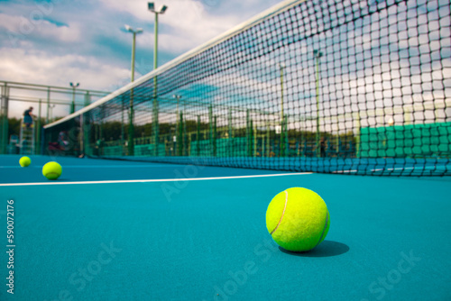 Tennis  ball on the blue-coated cour © Павел Мещеряков