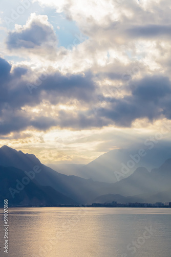 Landscape of Mediterranean sea with mountains in the distance during the sunset, Antalya, Turkey