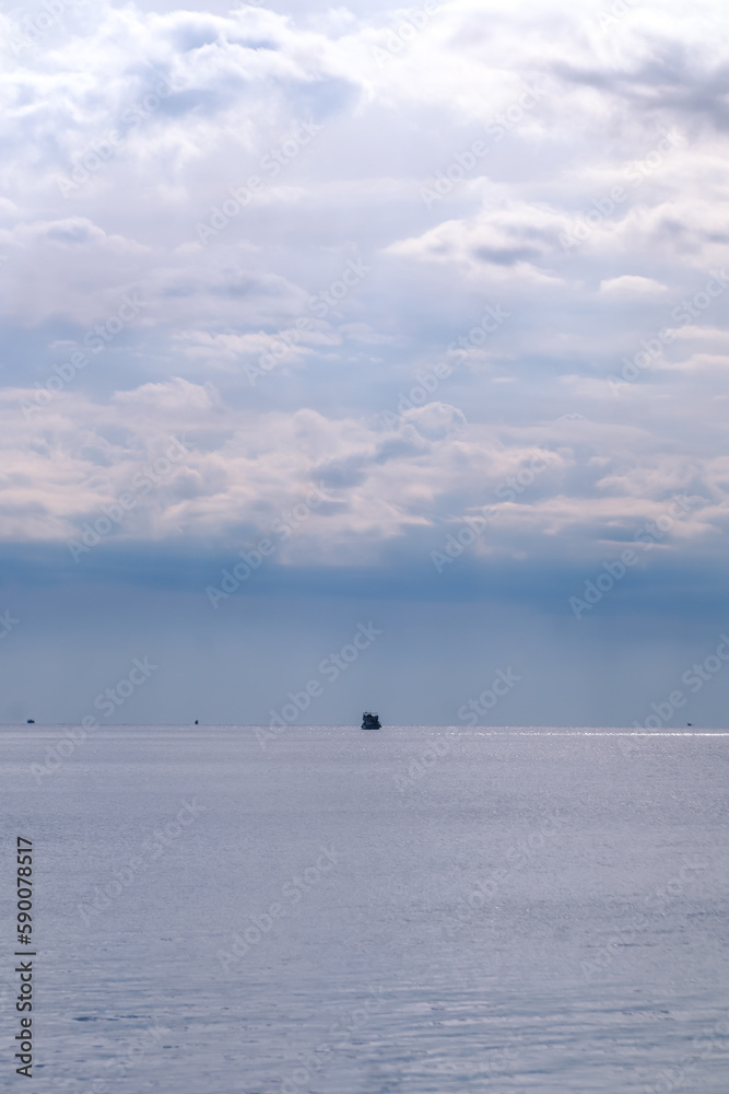Boat in the middle of the Meditarranean sea during a cloudy day Boat in the middle of the Meditarranean sea during a cloudy day