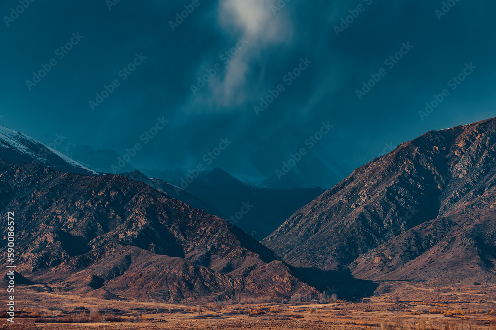 Fototapeta premium Mountain autumn landscape before the storm, Kyrgyzstan, dramatic colors
