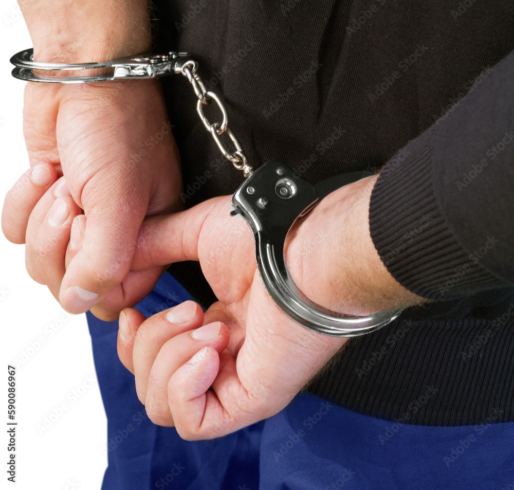 Convict with handcuffs behind their back