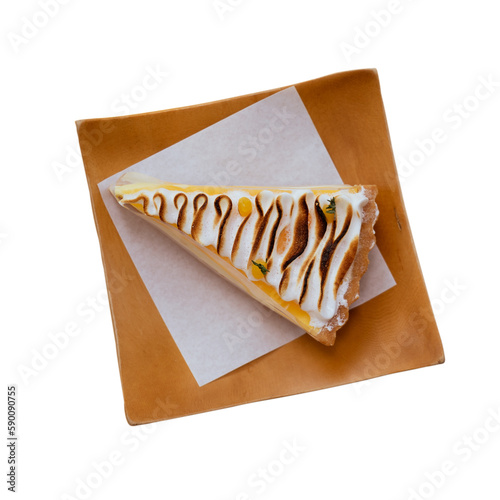 Lemon cheesecake tart or pie slice with fresh lemon curd meringue on wooden dish isolated.