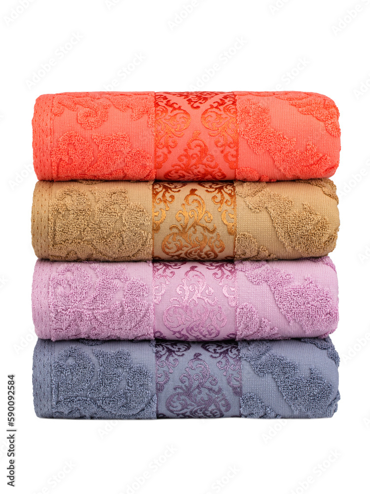 multicolored terry towels, rolled up and stacked on the table multicolored terry towels, rolled up and stacked on the table