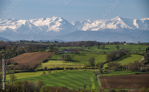 Beautiful spring landscape in the Gers department in the southwest of France   with snowy Pyrenees mountains