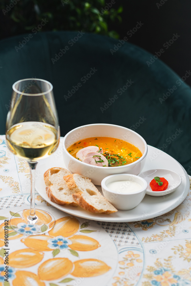 Chicken soup with noodles and vegetables in bowl. Healthy food concept Chicken soup with noodles and vegetables in bowl. Healthy food concept